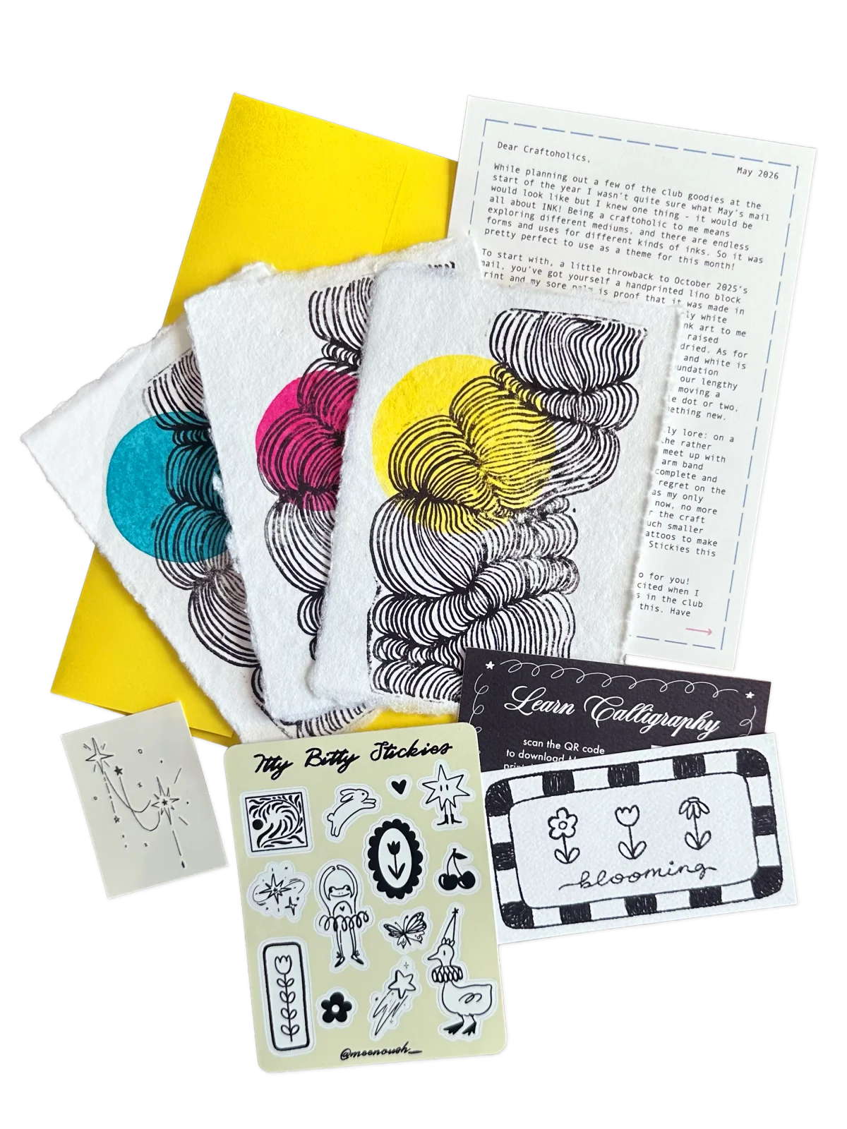 May’s black ink patterns with yellow, pink, and blue accents and a calligraphy card
