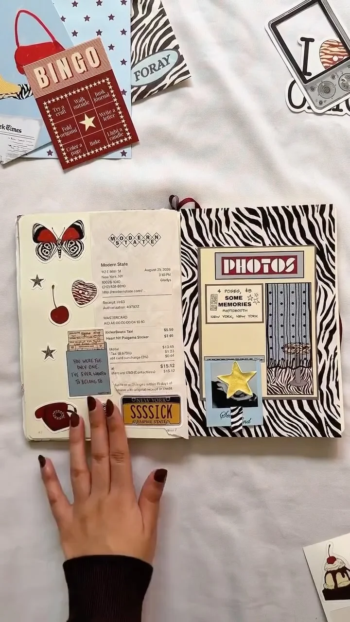 The creator’s journal spread with Memories paper pieces, zebra patterns, a receipt, and a photo-booth design