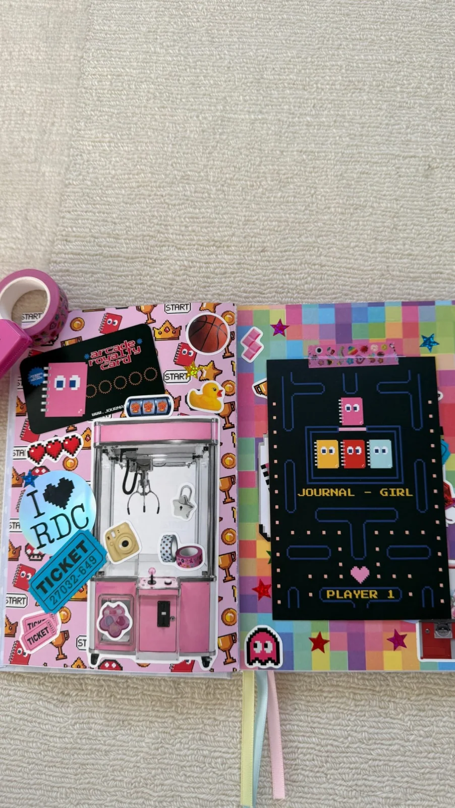 A journal spread with colorful arcade papers and a claw-machine design
