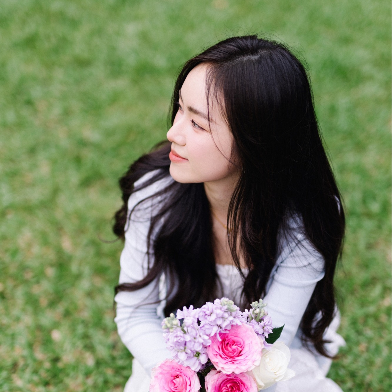 Lyeo holding flowers — official creator portrait