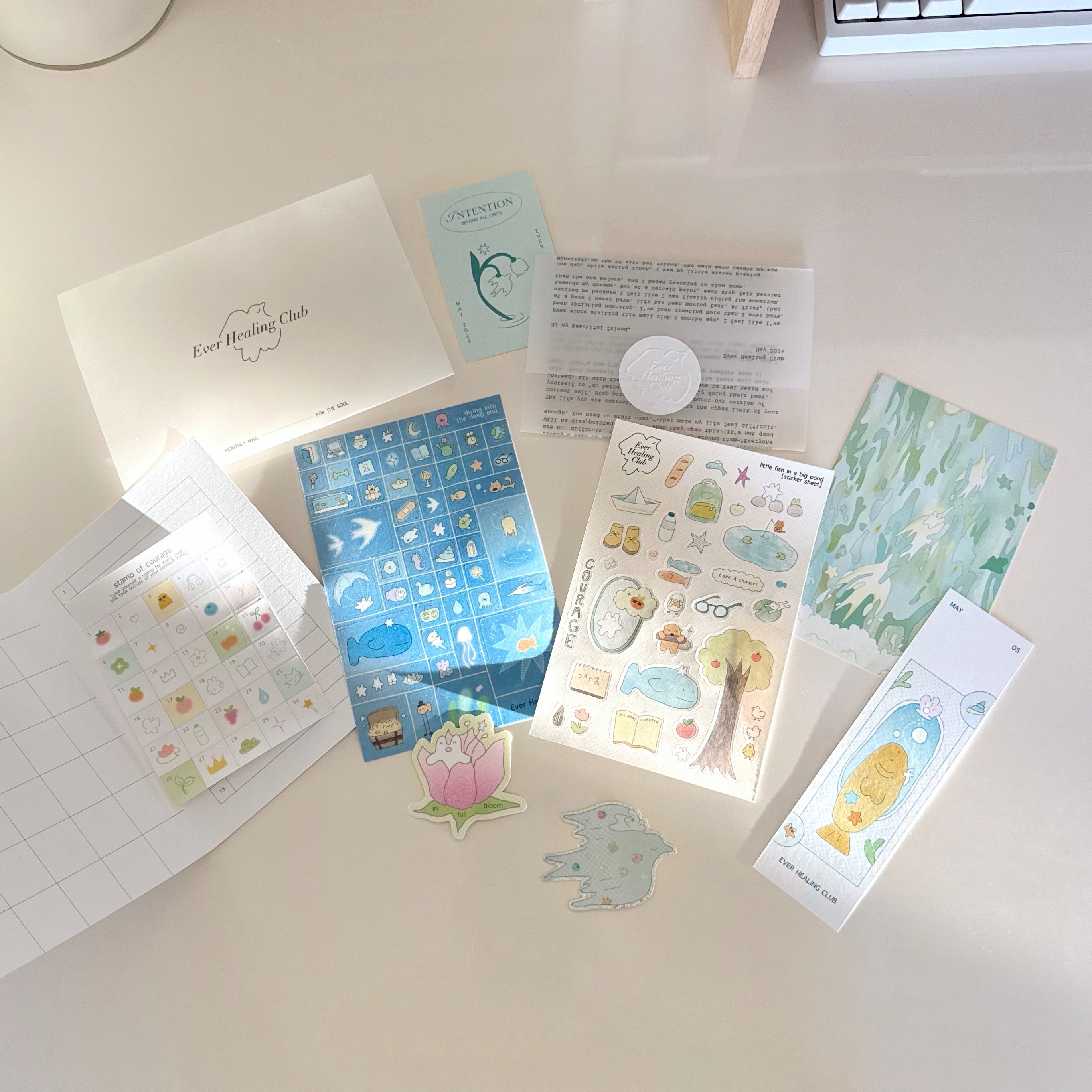 Ever Healing Club: May Signature edition with blue and green art and stationery