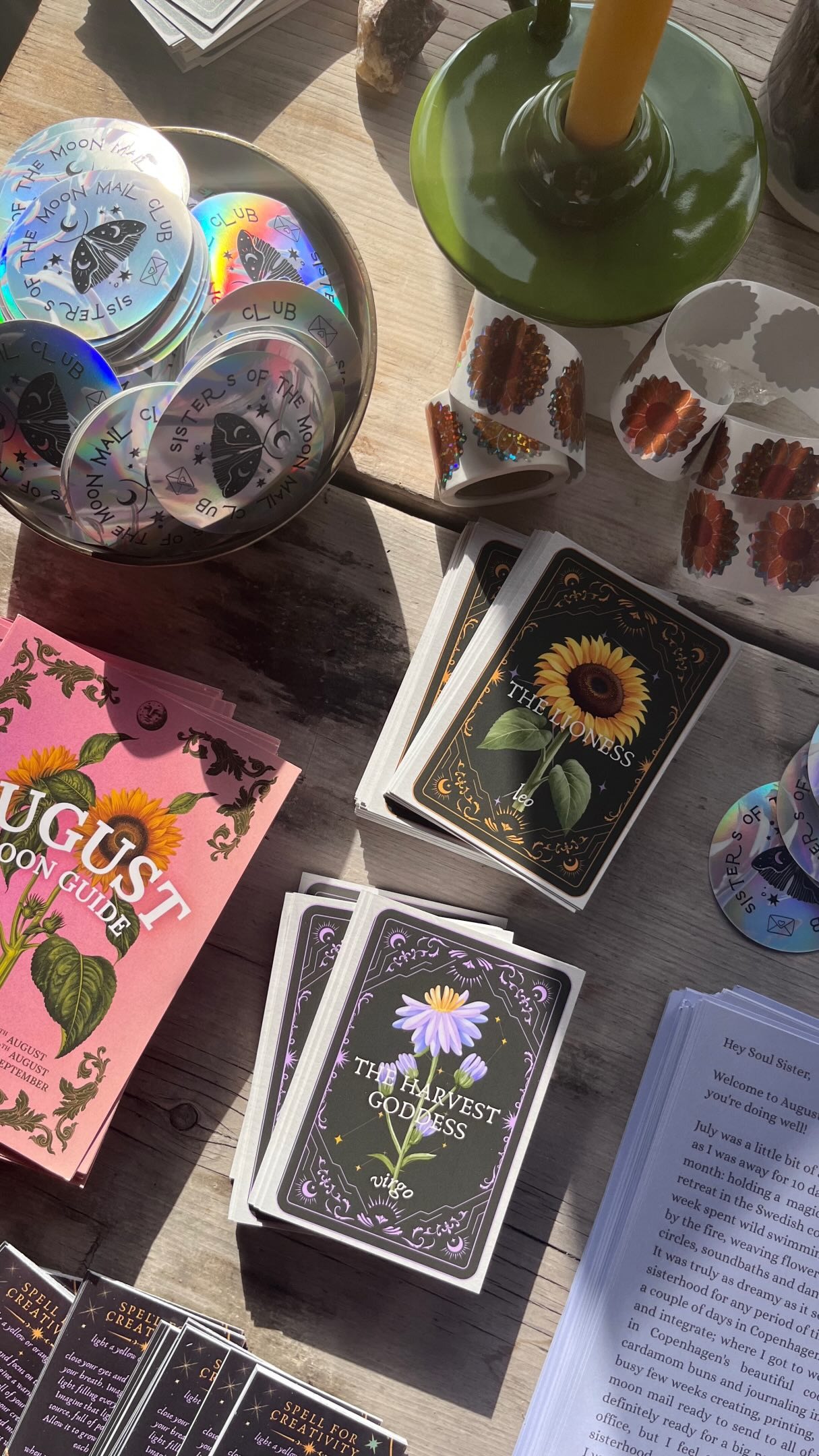 Sisters of the Moon — August edition letters, lunar guides, cards, and stickers being packed