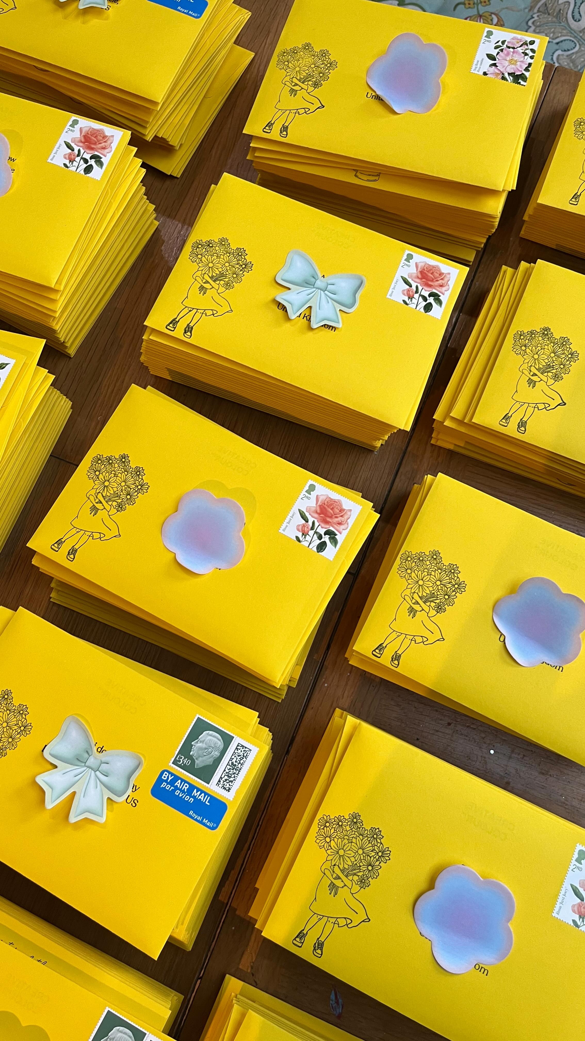Sisters of the Moon — Yellow illustrated envelopes prepared for mailing