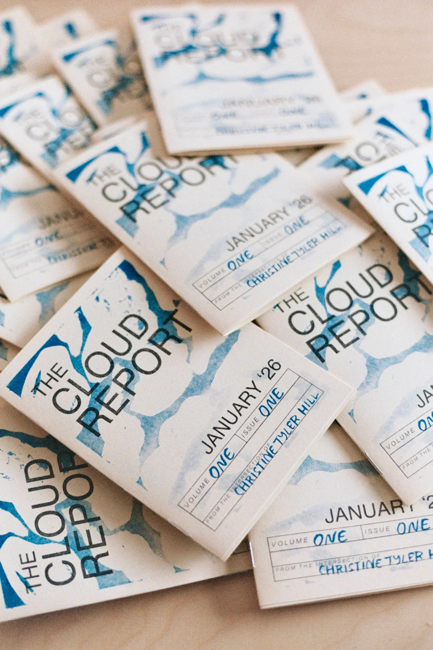 January 2026 issues of The Cloud Report spread across a table