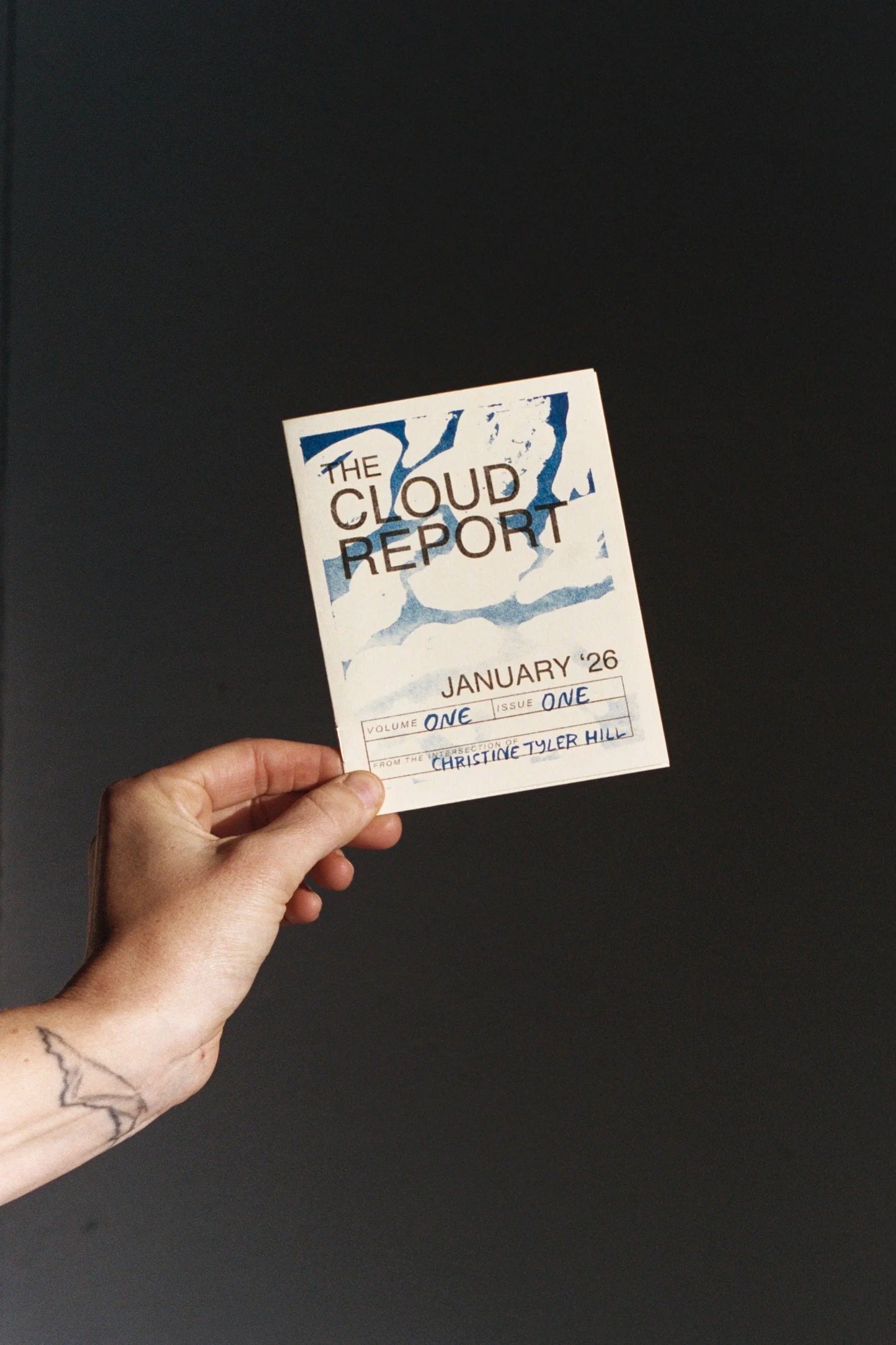 The January 2026 Cloud Report held in one hand to show its size