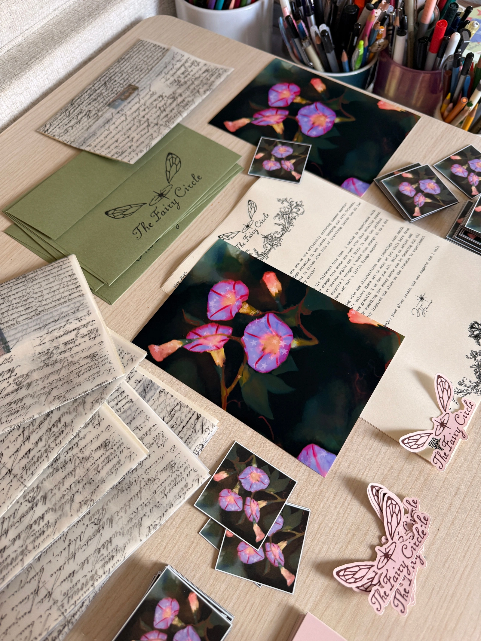 Fairy Circle Print Club — May 2026 art print and letter arranged with paper keepsakes