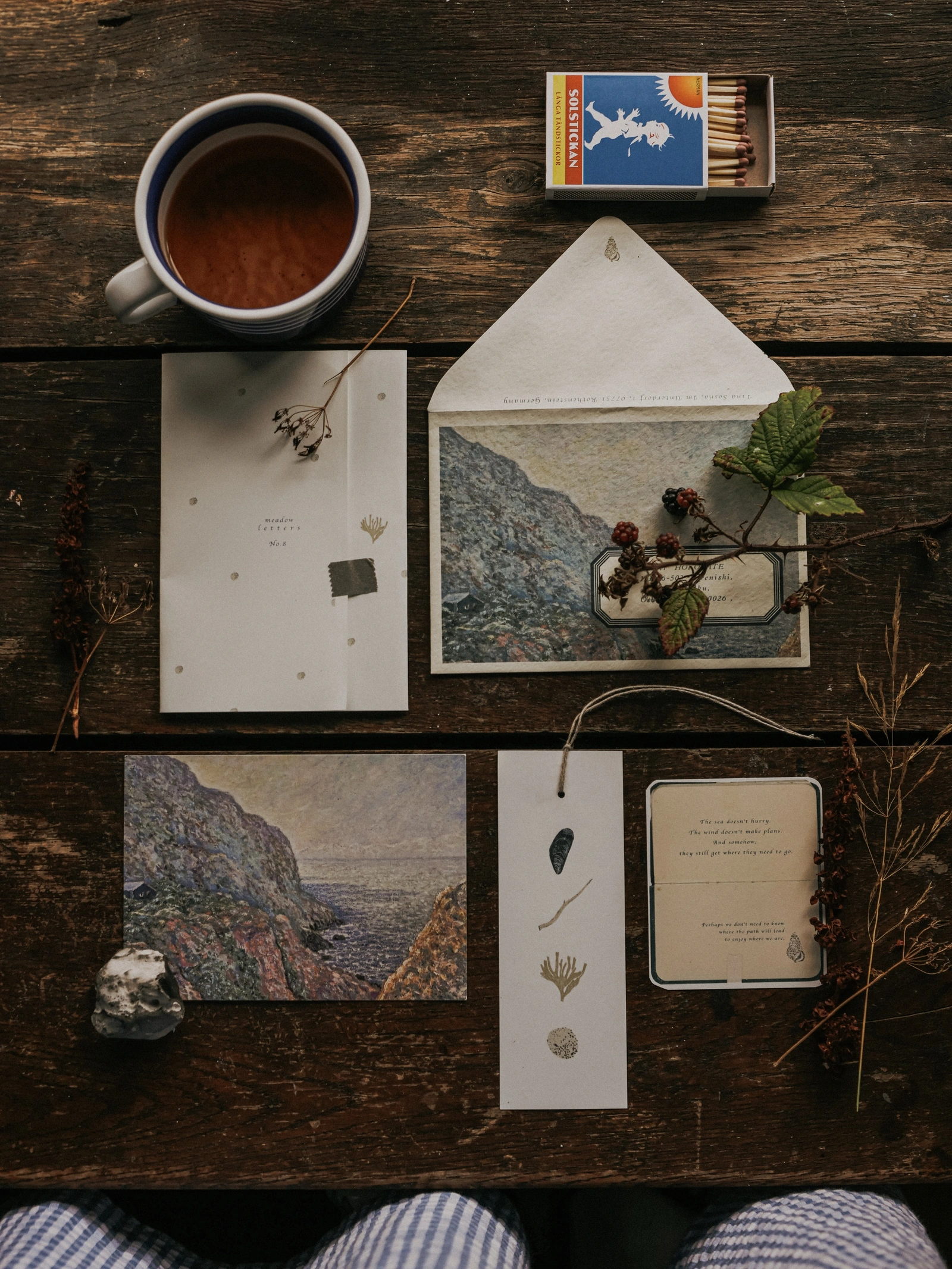 Meadow Letters: Coastal illustrated stationery, letter, bookmark, and envelope on a wooden table