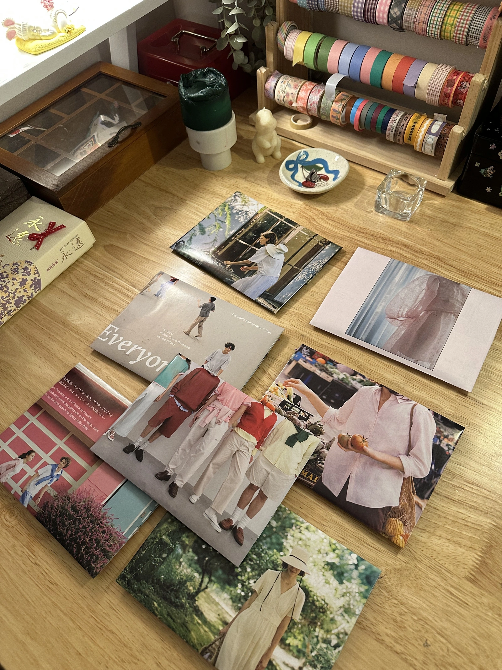 YES JUNK MAIL CLUB — handmade magazine-page envelopes spread across a table, August 2026