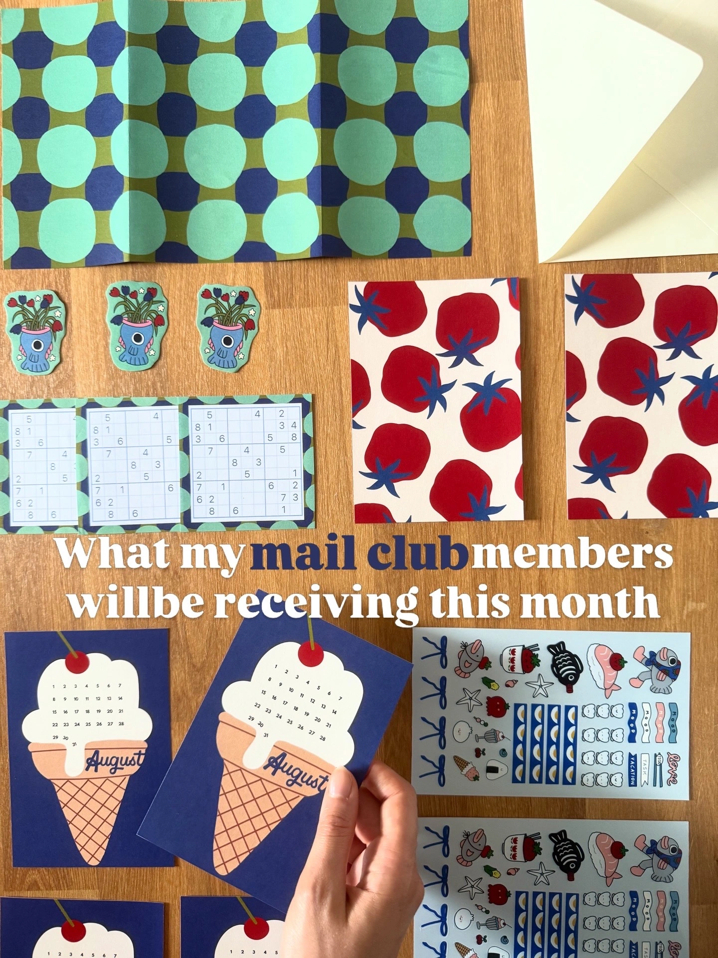 August Friend of Tomato mail designs arranged together, with an ice-cream calendar, tomato print, stickers and letter