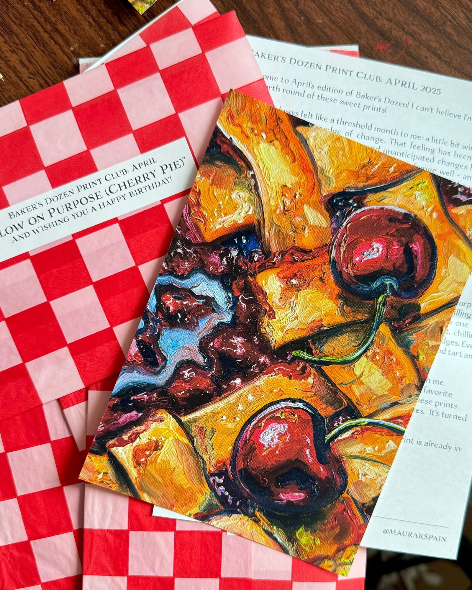 April 2025 cherry pie art print with a personal letter and red checked paper sleeve